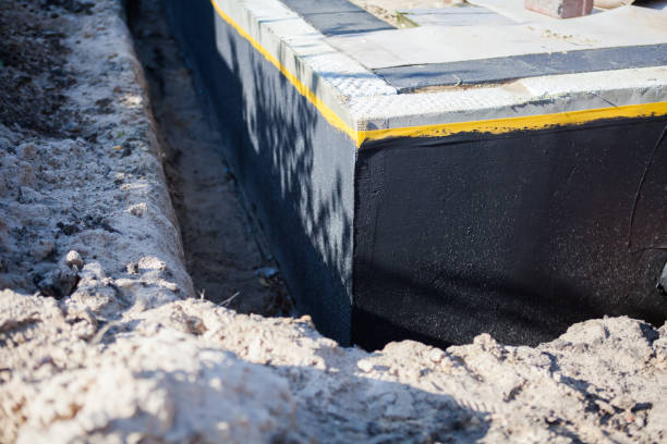 Professional Waterproofing technician working in Syosset, NY